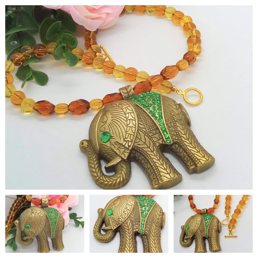 Bronze Elephant Pendant with Green Rhinestones on a Topaz Coloured Necklace