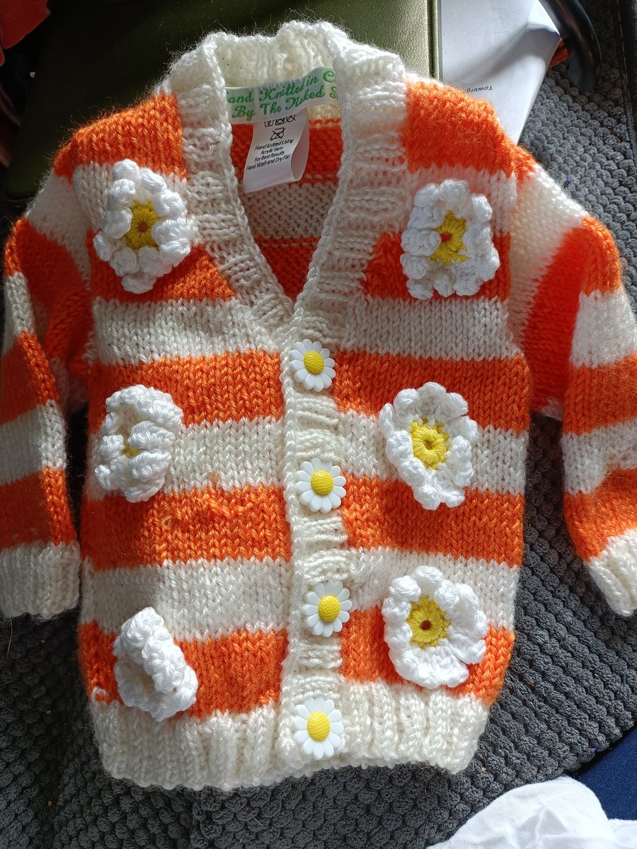 Orange and cream,floral, hand Knitted childrens cardigan 