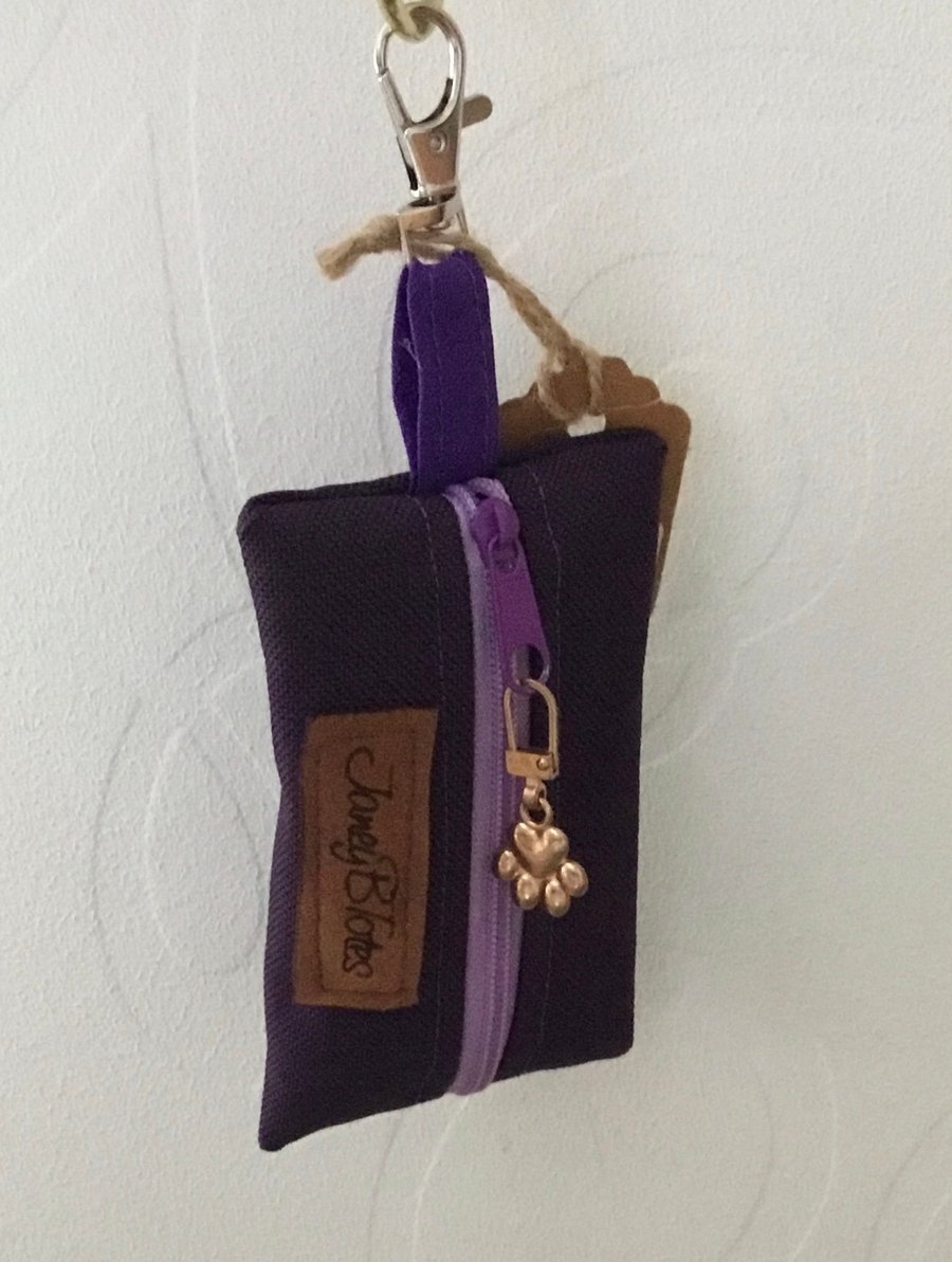 Purple dog bag carrier.