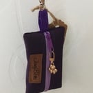 Purple dog bag carrier.