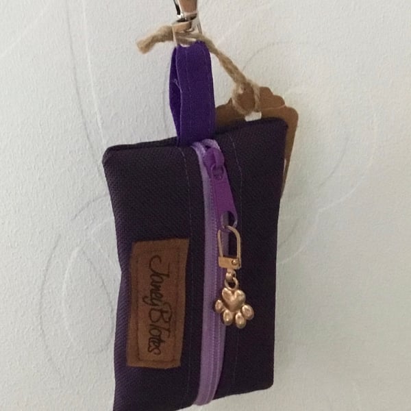 Purple dog bag carrier.