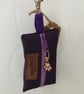 Purple dog bag carrier.