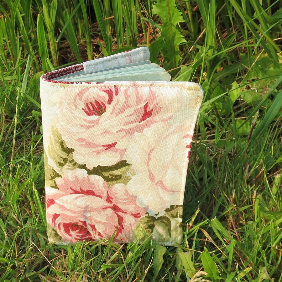 Blowsy roses.  A passport sleeve with a cottage garden design.