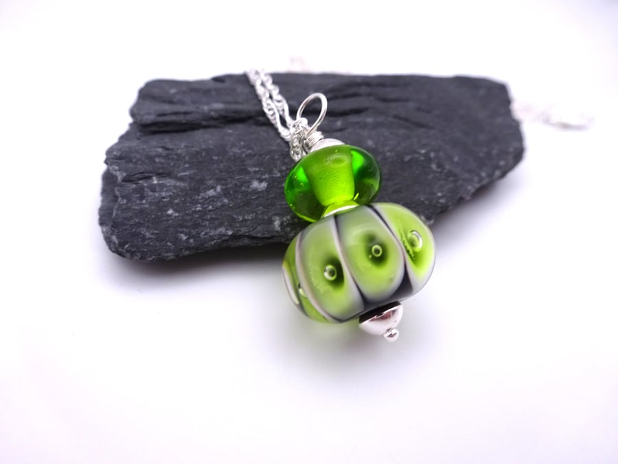 black and lime bubbles lampwork glass pendant