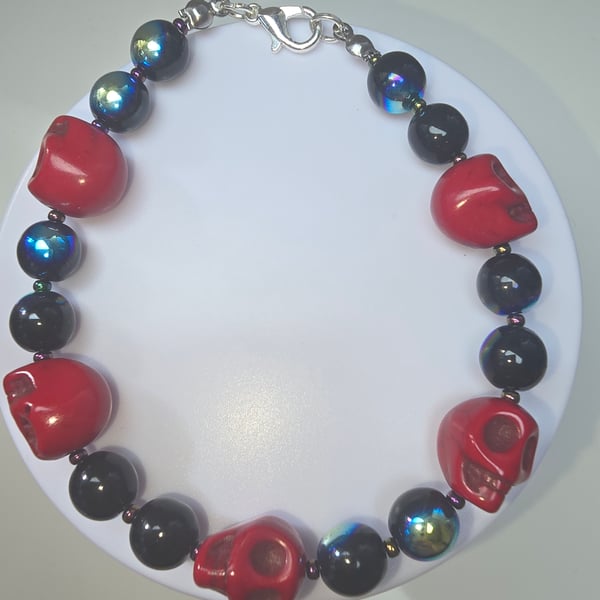 Large red skuls and black beded bracelet 