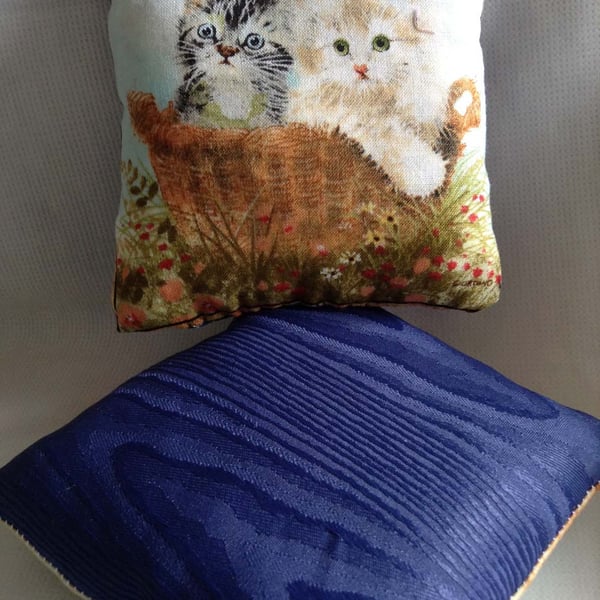 Pretty little kittens in a basket cushion 