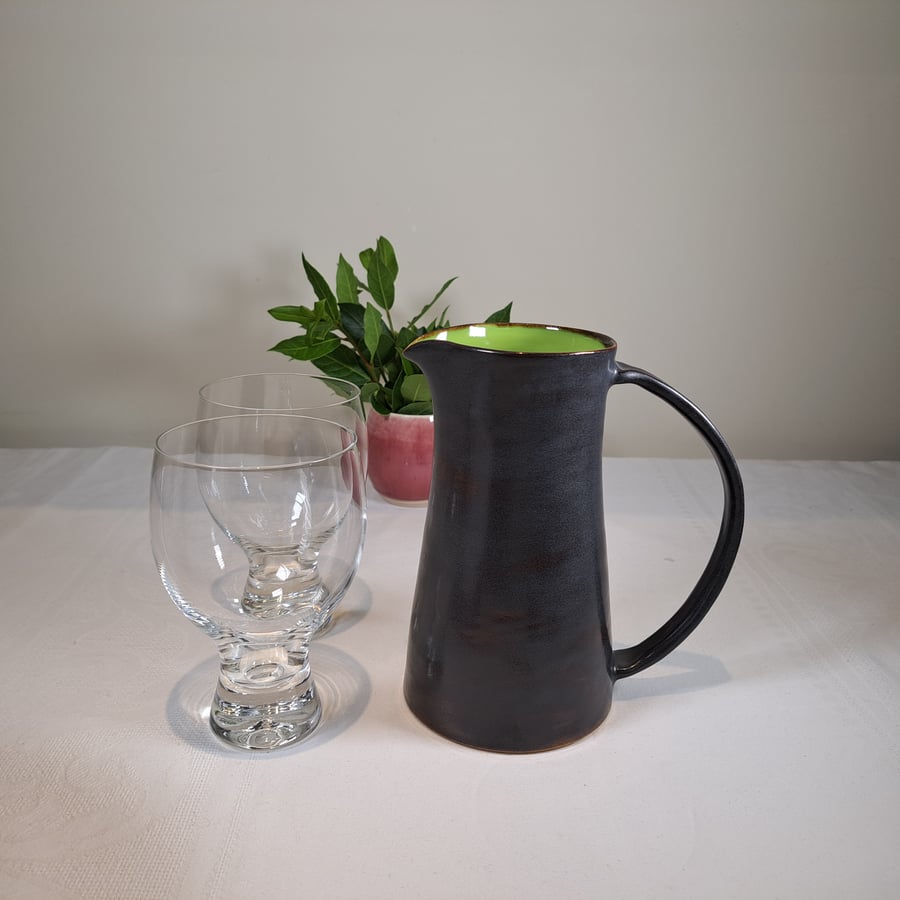 TALL LIME GREEN AND BLACK CERAMIC JUG