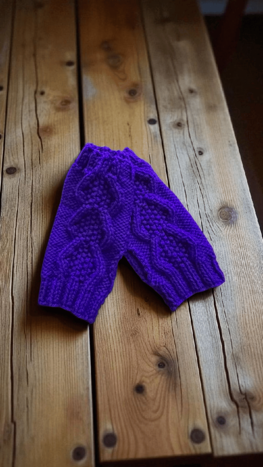 Hand knitted hand warmers