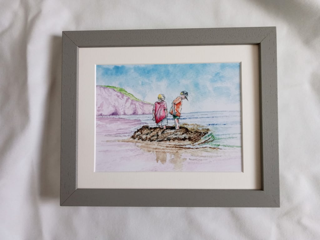 watercolour print of children on a Cornwall Beach building a sandcastle
