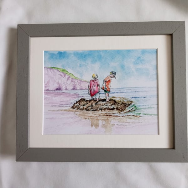 watercolour print of children on a Cornwall Beach building a sandcastle