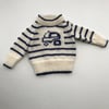 Luxurious baby jumper with a tractor design