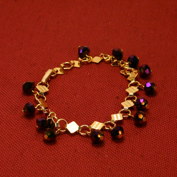 48 - GOLD METAL BRACELET WITH FACETED BEADS