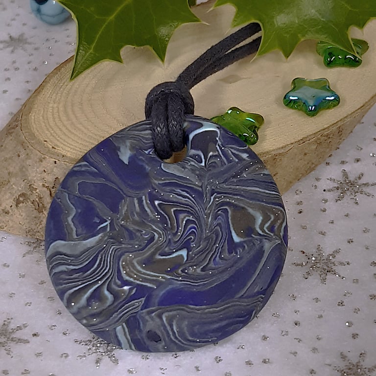 Round blue polymer clay pendant