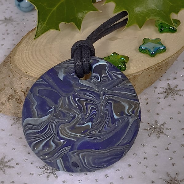 Round blue polymer clay pendant