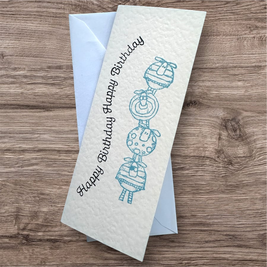 Funny Birthday card, cute tower of sheep and curly happy birthday text 