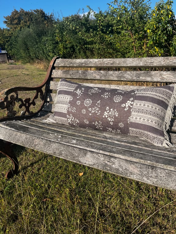 Long linen feature cushion with fringe trim