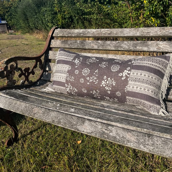Long linen feature cushion with fringe trim