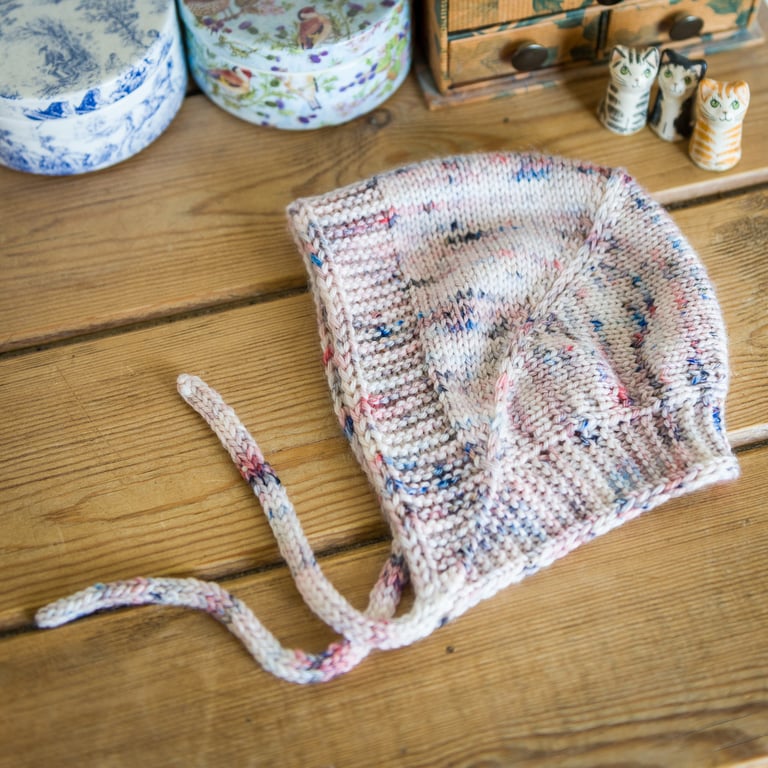 Baby hat vintage pixie style, hand knit in soft merino with integral tie