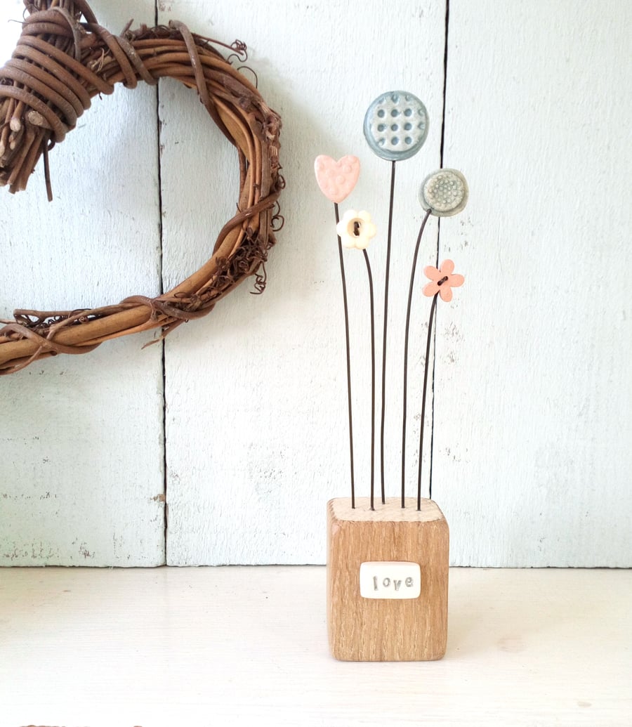 Clay Flower Garden with love heart on a Wooden Block 