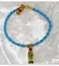 Bracelet Turquoise Faux Leather with gold plated Fish charm bead. - Image 1