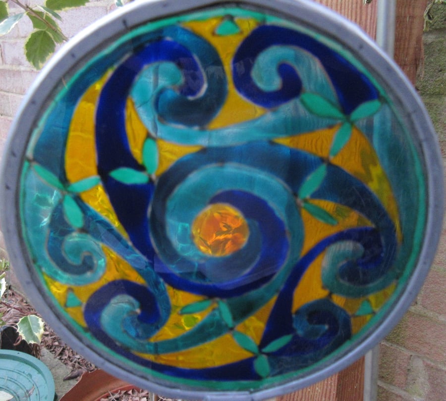 SOLD - Suncatcher - Celtic Spirals - Greens and Blues with saffron background