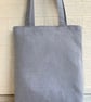 Penguin tote bag in pale blue with a paisley penguin in a purple bobble hat - Image 6