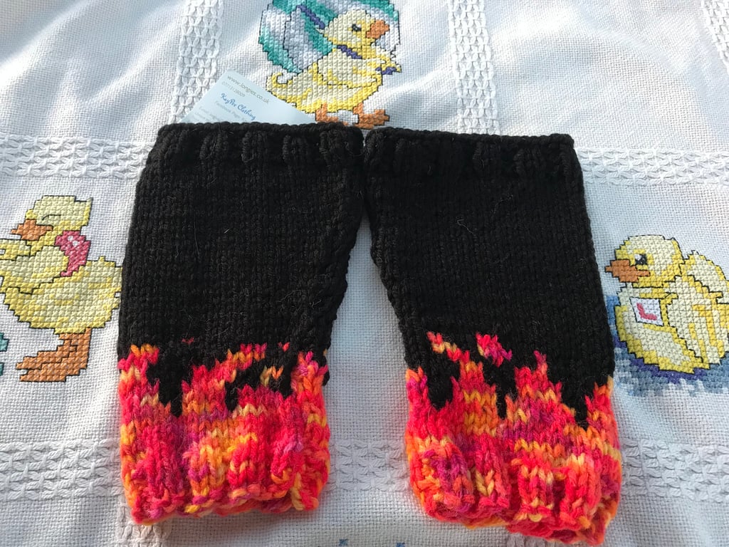 Hand knitted baby legs ,leg warmers .black and flames , Goth ,alternative baby