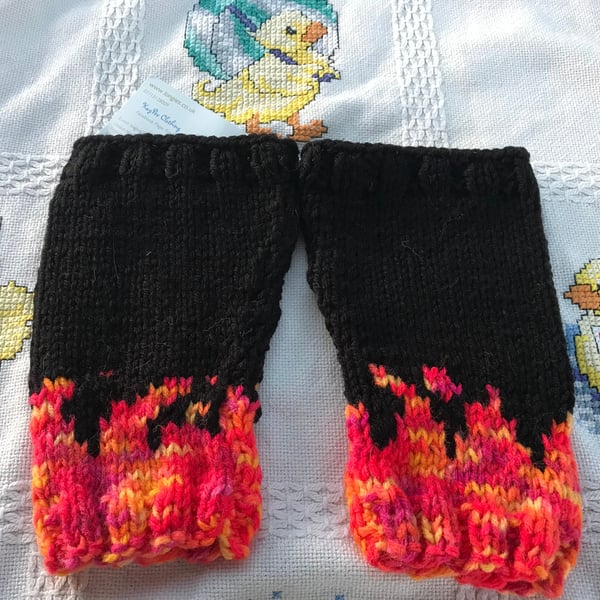 Hand knitted baby legs ,leg warmers .black and flames , Goth ,alternative baby