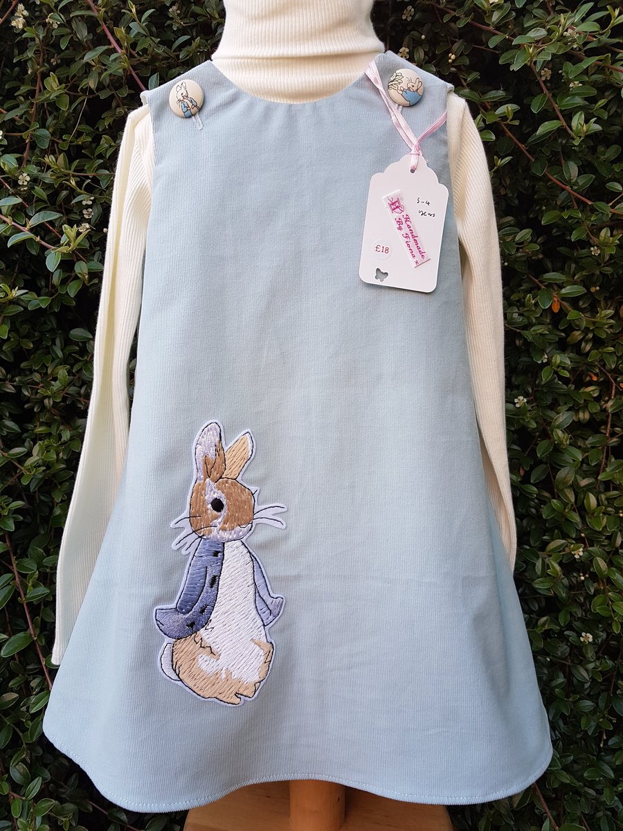 Age: 3-4y. Pale blue baby needlecord pinafore dress. 