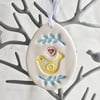 Pottery Easter Egg decoration with yellow bird and leaves