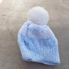 Bobble hat blue and white striped yarn faux fur pompom baby accessories.