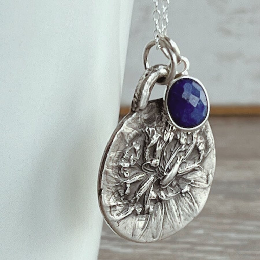 Botanical silver pendant featuring astrantia and lapis lazuil charm