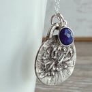 Botanical silver pendant featuring astrantia and lapis lazuil charm