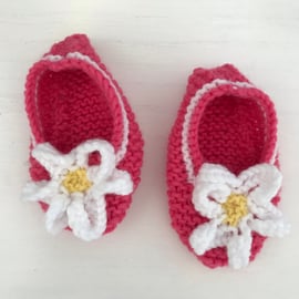 Pink shoes with flower trim