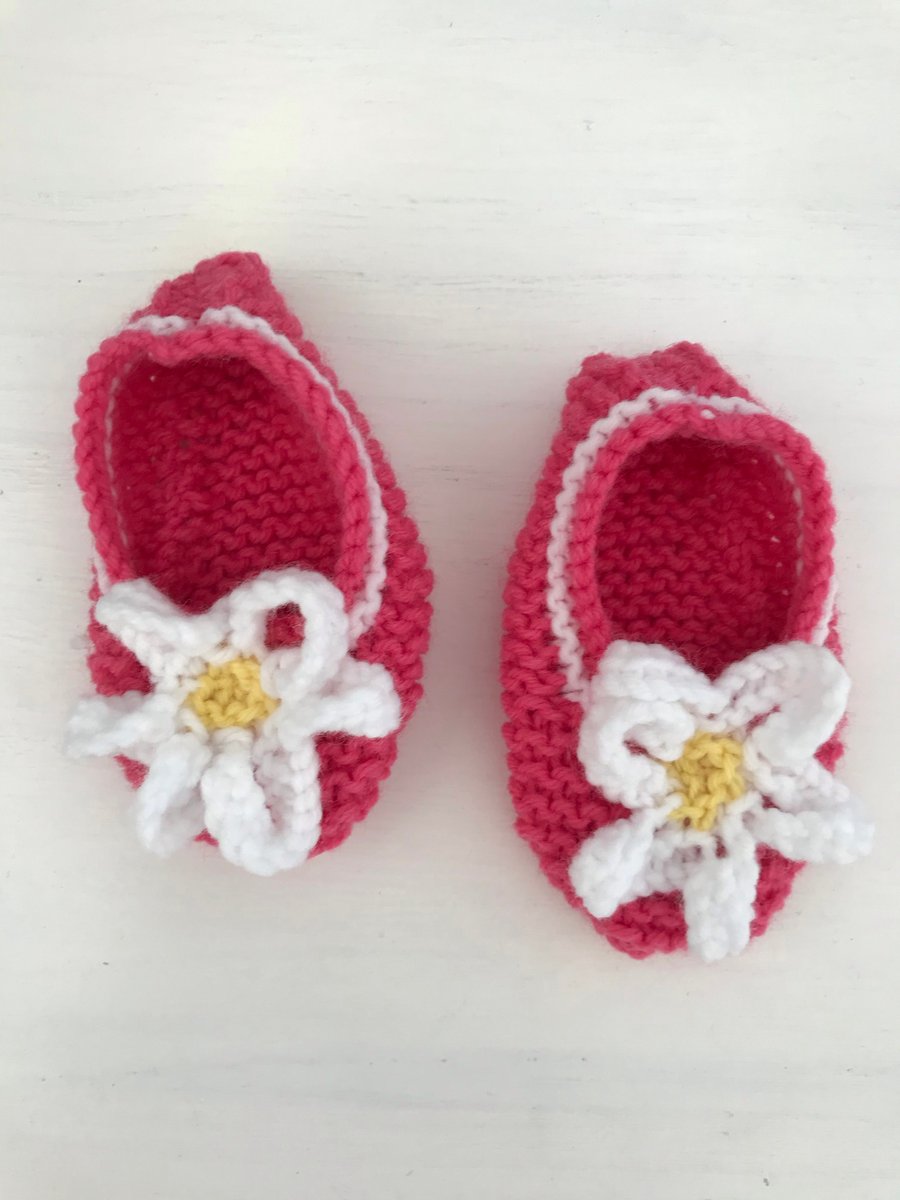 Pink shoes with flower trim