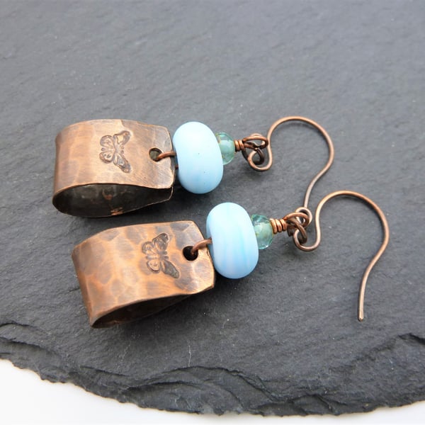 copper butterfly earrings, blue lampwork glass