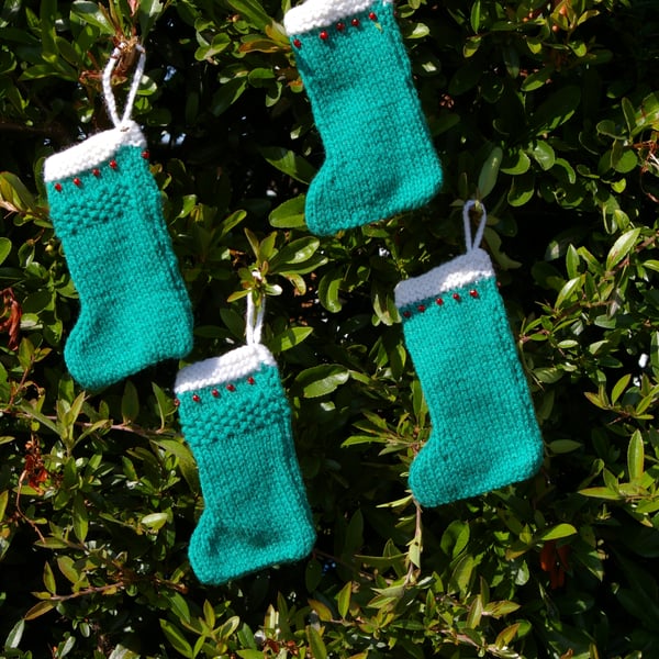 Four Christmas Stocking Decorations knitted in Green
