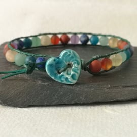 Chakra matt gemstone bead and leather bracelet with ceramic heart button 