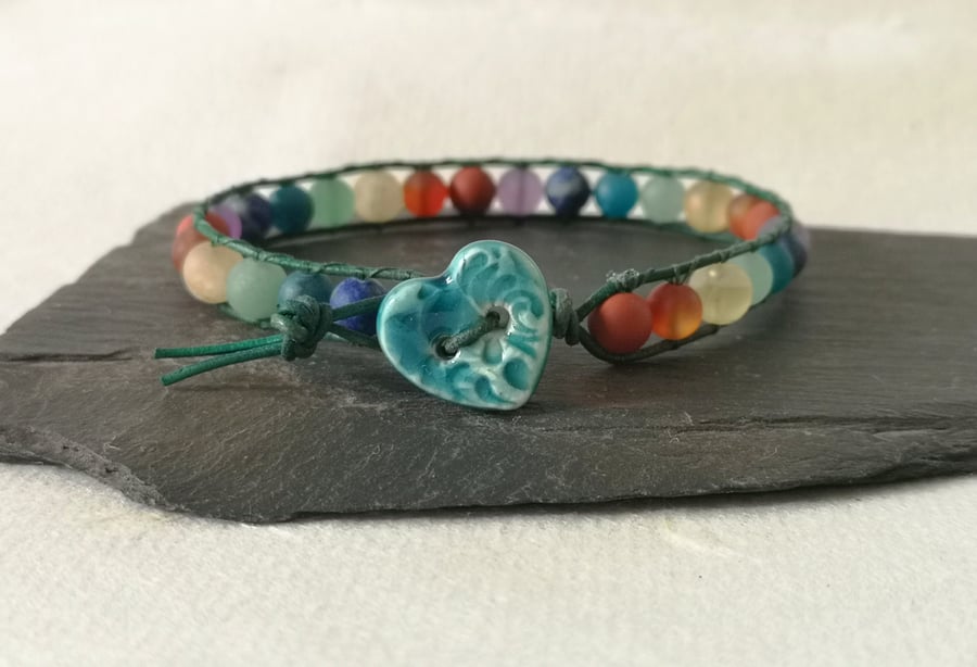 Chakra matt gemstone bead and leather bracelet with ceramic heart button 