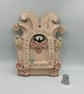 Ceramic wall shrine