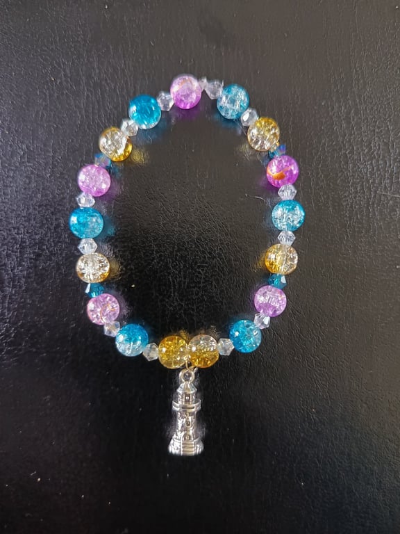 Elasticated nautical bracelet with lighthouse charm and colourful beads
