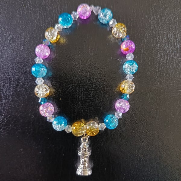 Elasticated nautical bracelet with lighthouse charm and colourful beads