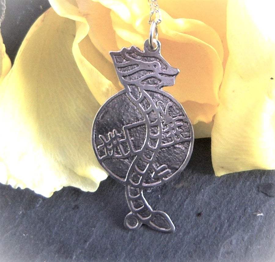 Dragon pendant etched in sterling silver