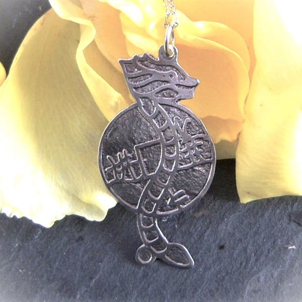 Dragon pendant etched in sterling silver