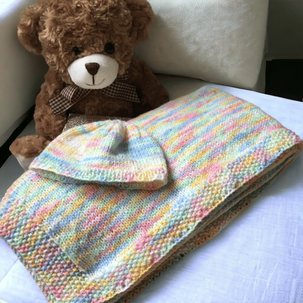 Hand knitted blanket with matching newborn hat