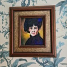 Vintage Woman in blue with hat in ornate frame