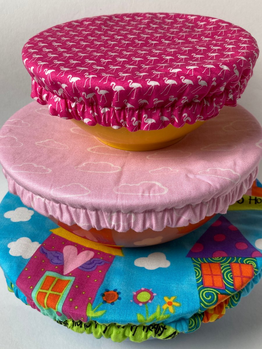 Three reusable bowl covers. Pinks and turquoise patterns.