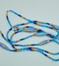 Long Summer Swirl Beaded Necklace in shades of blue with handmade paper beads - Image 2
