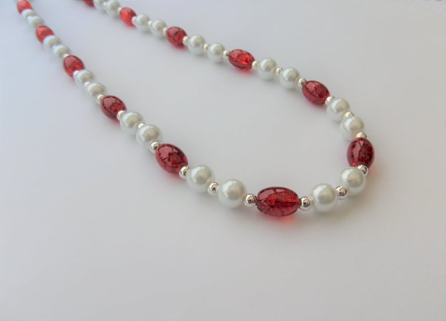 White glass pearl and oval red crackle glass bead necklace.