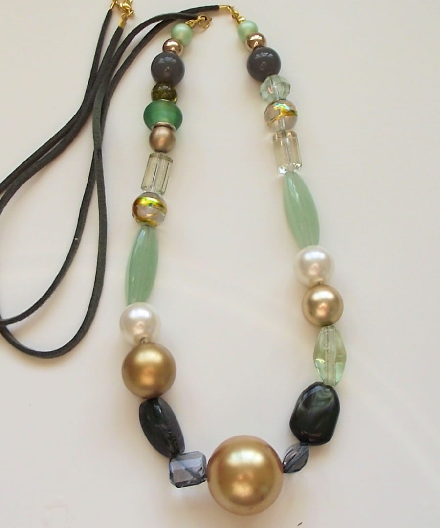 Long green and gold mixed bead necklace